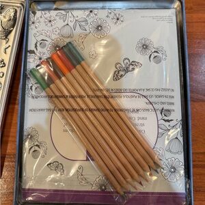 Set of Colored Pencils and Coloring Books with Floral Design